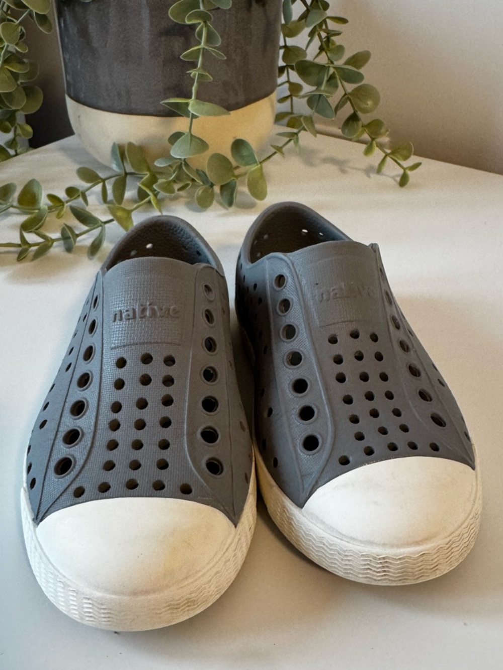Native Slip-On Sneakers in Charcoal Gray with White Toe Caps Size C8